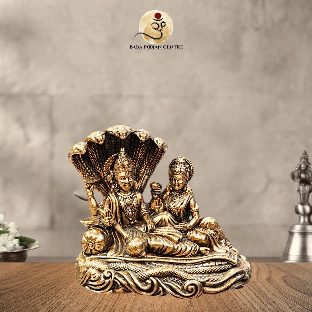 Lord Vishnu and Goddess Lakshmi sheltered beneath the sacred coils of Adi Shesha.